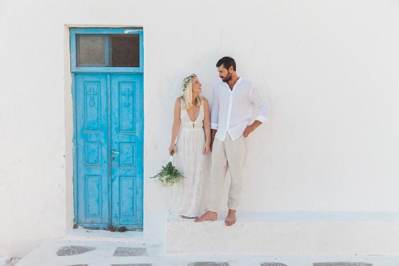 Newlyweds Outside a Blue and White Church In Santorini