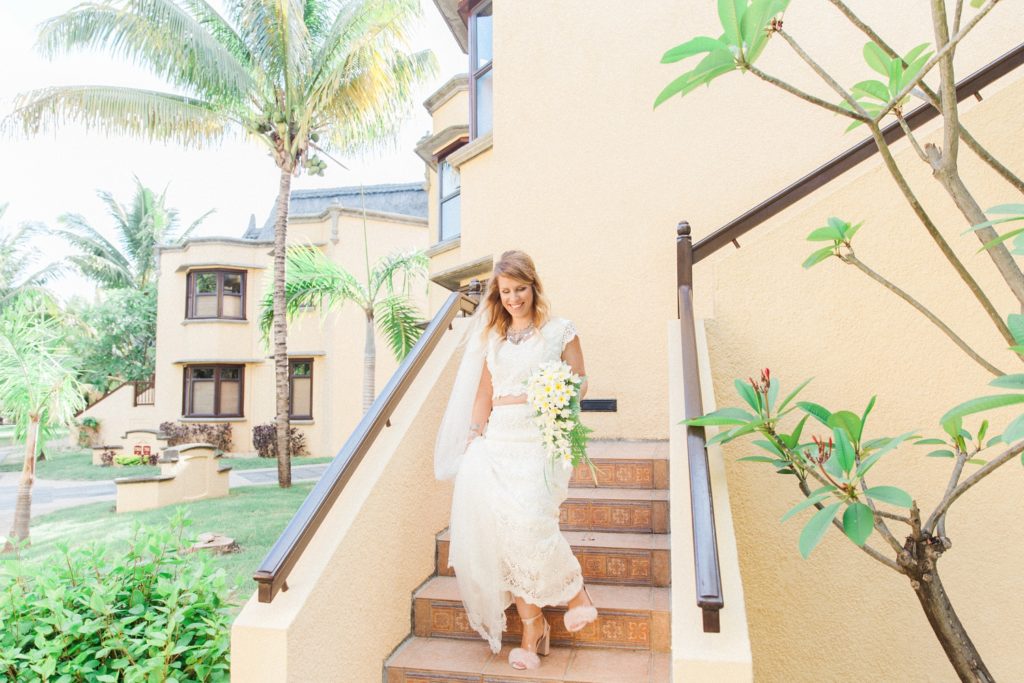 Bride leaves her suite to meet her father on the morning of her wedding in Mauritius