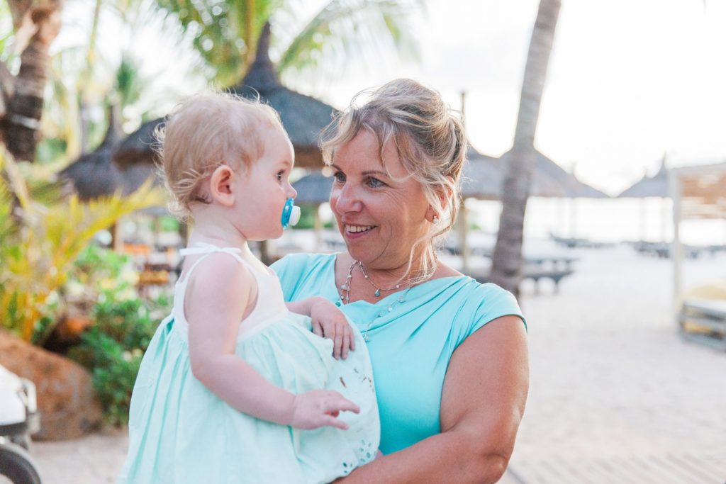 Wedding guest and baby on the beach in Mauritius