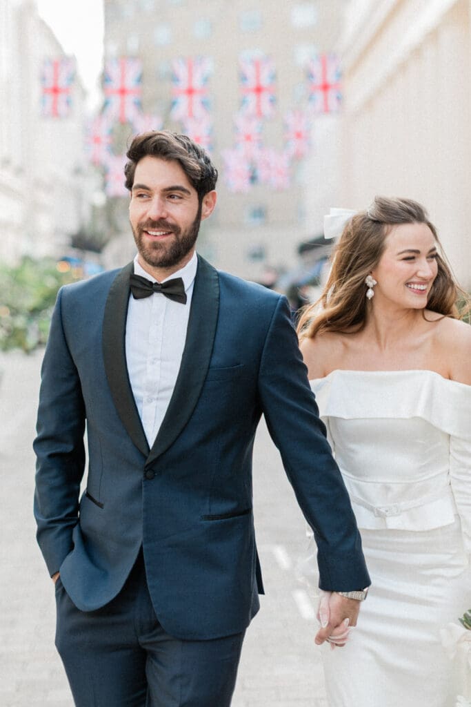 Bride and Groom walking along the streets of London following their legal ceremony.
