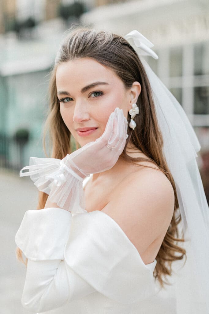 Close up of the brides face and her jewellery and accessories.