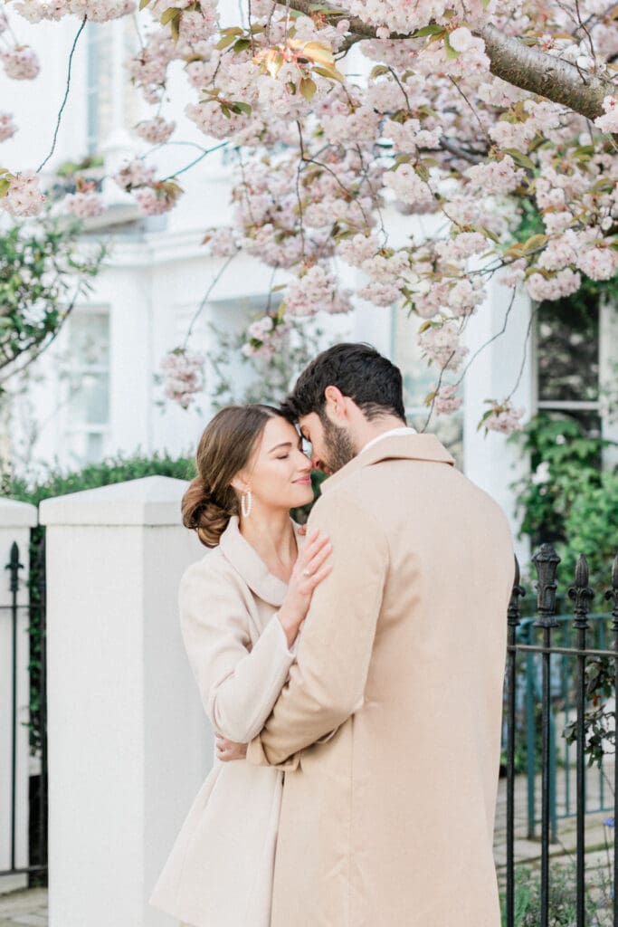 Couple sharing a quiet moment during their engagement shoot in Notting Hill