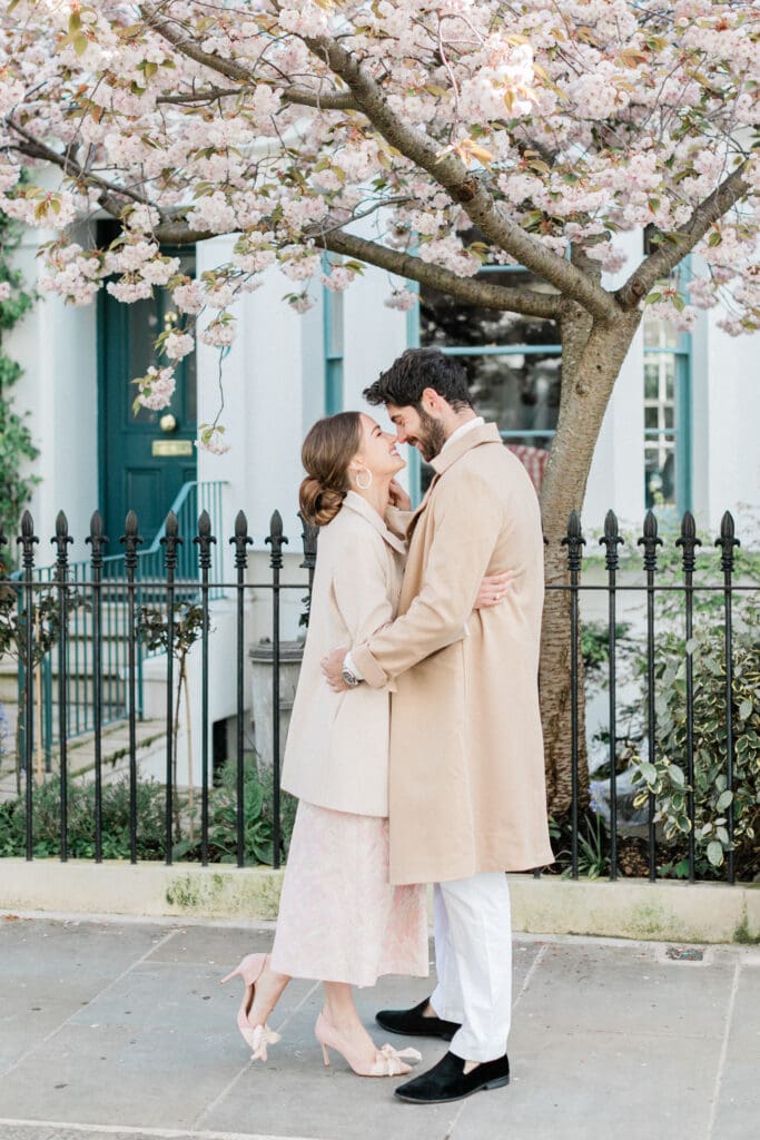 Couple kissing at their engagement shoot in Notting Hill