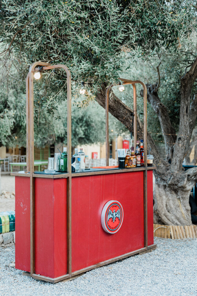 Cocktail bar at outdoor wedding reception in Greece.