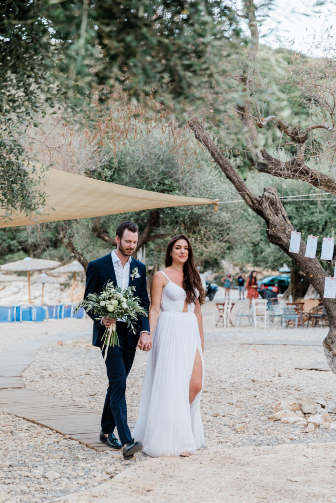 Bride and Groom arriving at their outdoor Greek Wedding reception in Ithaca.